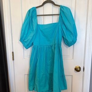 A new day size medium Vibrant Teal Puff Sleeve Dress with pockets like new